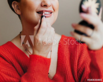 Putting on lipstick Putting on lipstick