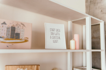 Quote Sign Standing on Wooden Shelf Quote Sign Standing on Wooden Shelf