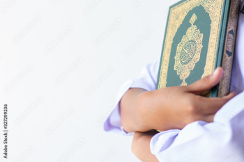 Quran - holy book of Muslims religion, Concept: open book holy prayers for god,  Friday In the month of Ramadan  religion Islamic worshiping faith and learn koran and rosary put on wooden  boards 