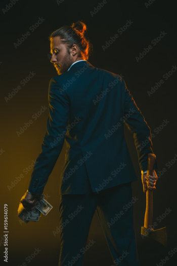 rear view of young man in tuxedo with ax and us dollar banknotes rear view of young man in tuxedo with ax and us dollar banknotes