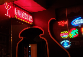 Red and White Buddha Neon Lights Sign during Night Time Red and White Buddha Neon Lights Sign during Night Time