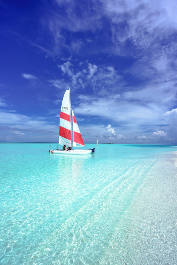 Red and White Watercraft on Body of Water Red and White Watercraft on Body of Water