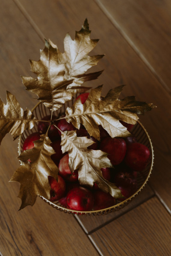 Red apples and golden oak leaves Red apples and golden oak leaves