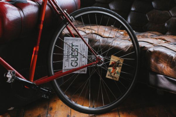 red bike beside sofa red bike beside sofa