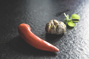 Red Chili Beside Brown Bead and Green Leaf