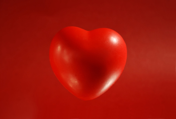 Red heart on red background Red heart on red background