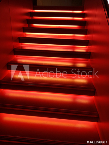 Red illuminated stairs indoors