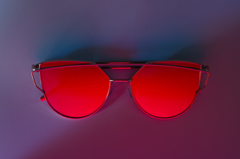 Red Sunglasses on Pink Surface Red Sunglasses on Pink Surface