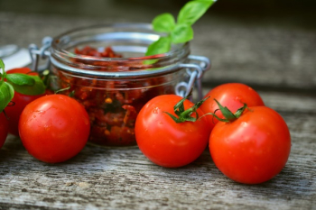 Red Tomatoes Near Glass Jar Red Tomatoes Near Glass Jar