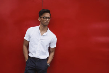 Red Wall Behind Men's Summer Fashion Red Wall Behind Men's Summer Fashion