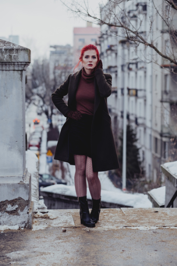 Redhead woman posing in th city Redhead woman posing in th city