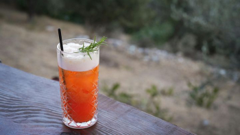 Refreshing Cocktail with Herbal Garnish Refreshing Cocktail with Herbal Garnish