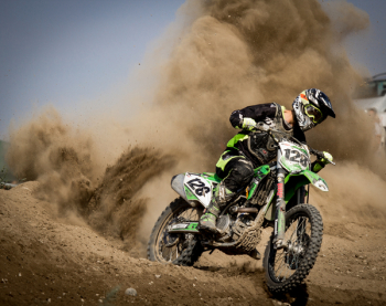 Rider Riding Green Motocross Dirt Bike Rider Riding Green Motocross Dirt Bike
