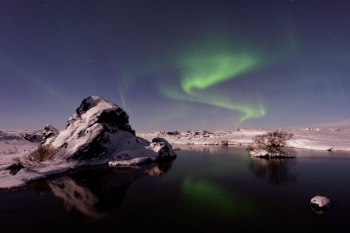 river beside snowfield under aurora borealis river beside snowfield under aurora borealis