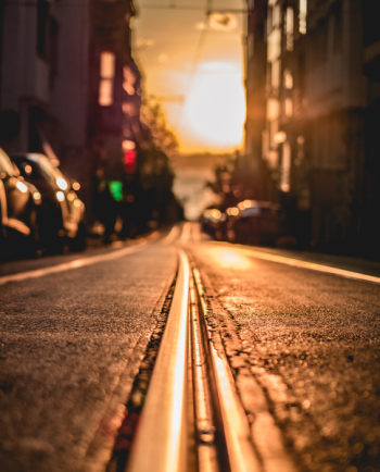 Road Between Buildings during Sunset Road Between Buildings during Sunset