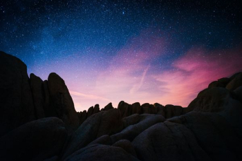 rock mountain during starry night rock mountain during starry night