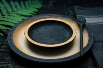 round black-and-brown wooden plate round black-and-brown wooden plate