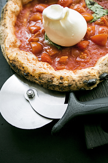Round Pizza With Black Wooden Surface Round Pizza With Black Wooden Surface