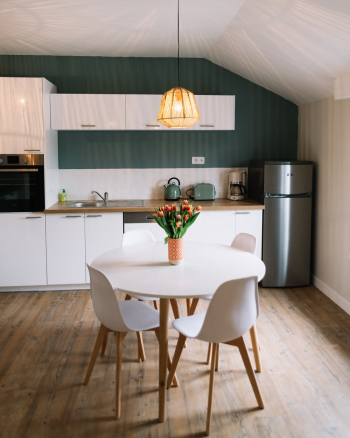 Round White Wooden Table and Three White Chairs Round White Wooden Table and Three White Chairs