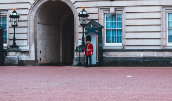 Royal Guard Standing Beside Building Royal Guard Standing Beside Building