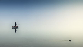 rule of thirds photography of man on boat rule of thirds photography of man on boat