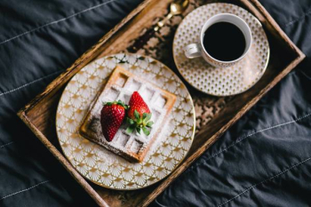 Saffle with strawberries and cup of coffee Saffle with strawberries and cup of coffee