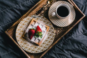 Saffle with strawberries and cup of coffee Saffle with strawberries and cup of coffee