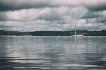 sail boat on body of water sail boat on body of water