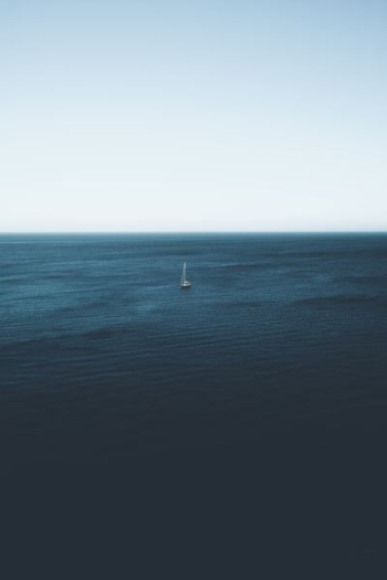 sailboat on body of water during daytime sailboat on body of water during daytime