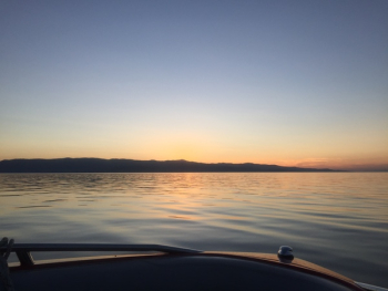 Sailboat on Body of Water during Sunset Sailboat on Body of Water during Sunset