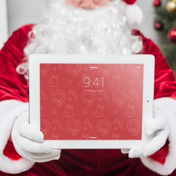 Santa presenting tablet mockup Free Psd