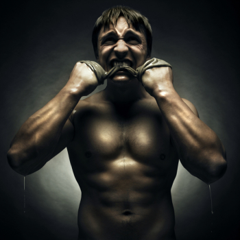 Savage athlete with a rag in his mouth