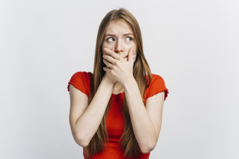 Scared woman covering her mouth Free Photo Scared woman covering her mouth Free Photo