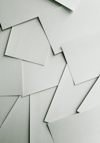 Scattered sheets of white paper covering the entire frame Scattered sheets of white paper covering the entire frame