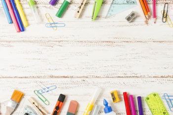 School supplies frame on wooden background Free Photo