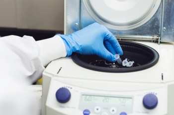 Scientist Places Test Tube Scientist Places Test Tube