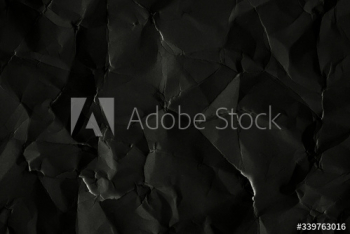 Scrunched black paper background Scrunched black paper background