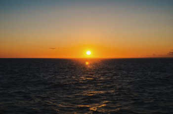 sea during sunset sea during sunset