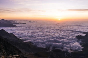 sea of clouds during golden hour sea of clouds during golden hour