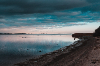 Seashore Under Cloudy Sky during Golden Hour Seashore Under Cloudy Sky during Golden Hour