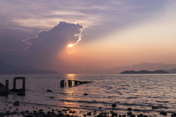 Seashore Under Cloudy Sky in Golden Hour Photography