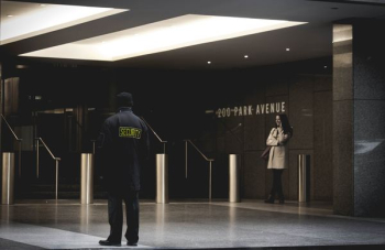 security guard standing on the gray floor security guard standing on the gray floor