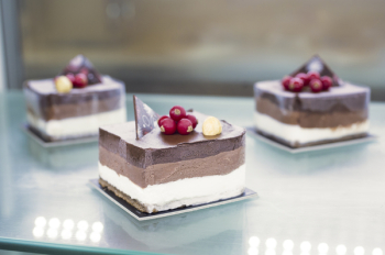 Selective Focus Photo of Sliced Cake on Table