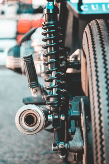 Selective Focus Photography of Black Metal Coilover Selective Focus Photography of Black Metal Coilover
