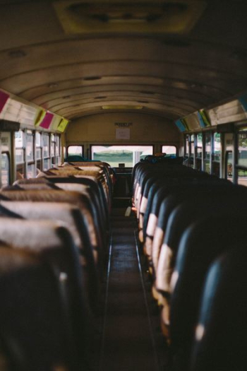 selective focus photography of bus interior selective focus photography of bus interior
