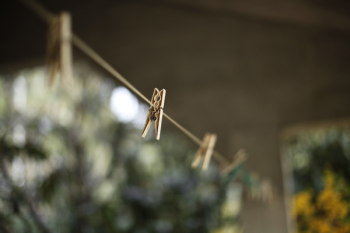 Selective Focus Photography of Clothes Hanger Clip Selective Focus Photography of Clothes Hanger Clip