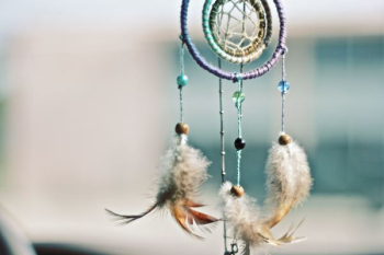 selective focus photography of multicolored dream catcher selective focus photography of multicolored dream catcher
