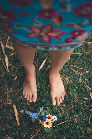 Selective Focus Photography of Person in Front of Yellow Petaled Flowers Selective Focus Photography of Person in Front of Yellow Petaled Flowers