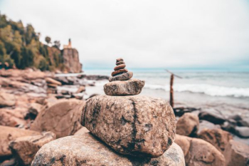 selective focus photography of stone balance selective focus photography of stone balance