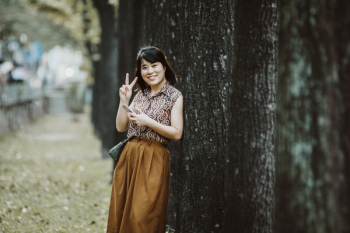 Selective Focus Photography of Woman Taking Hand Peace Symbol